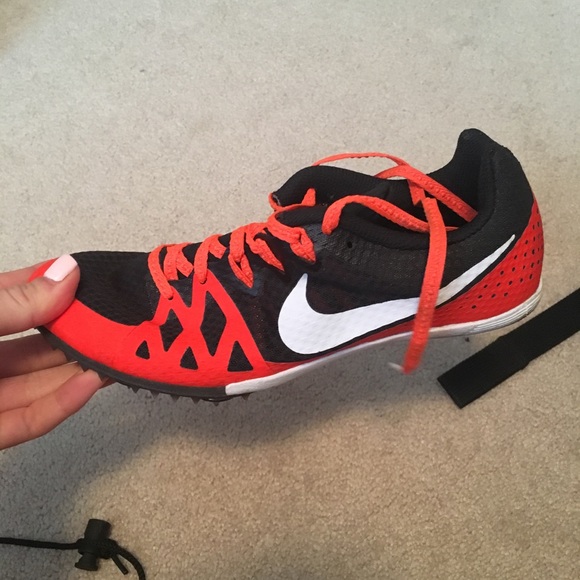 red and black track spikes
